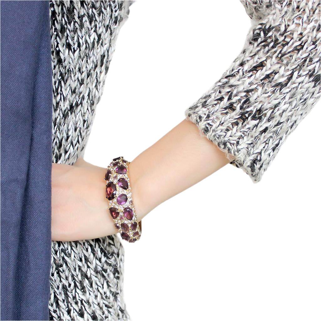 Elegant amethyst gemstone bangle bracelet showcased on a woman's wrist, perfect for any occasion
