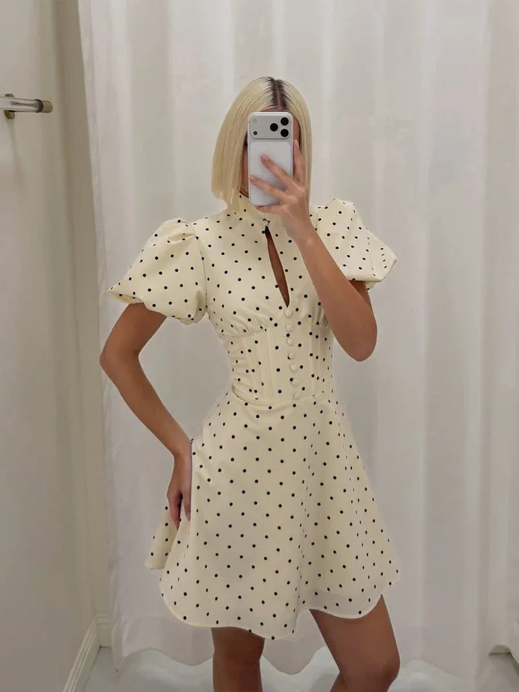 Cream polka dot mini dress with puff sleeves and tailored fit for casual outings and maxi dress.