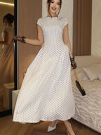 White polka dot and maxi dress for elegant summer events