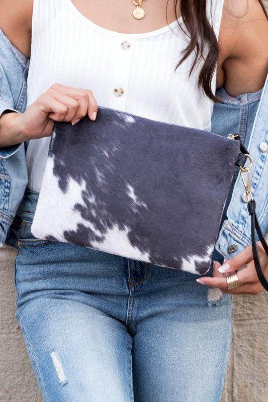 Stylish animal print clutch bag in black and white, perfect for casual outings and accessorizing