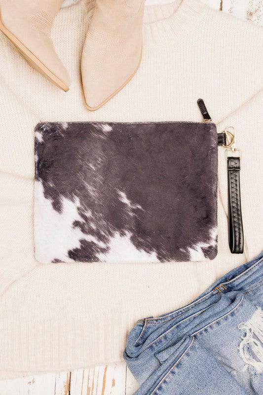 Stylish animal print clutch bag with a sleek design, perfect for any occasion or outfit