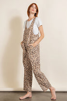 Stylish women's animal print vacation outfit featuring a comfortable jumpsuit with pockets