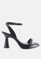 Stylish black ankle strap kitten heel sandals with a modern design and comfortable fit