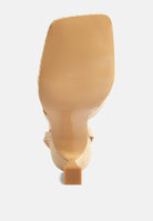 Bottom view of London Rag International ankle strap spool heel sandals with textured design