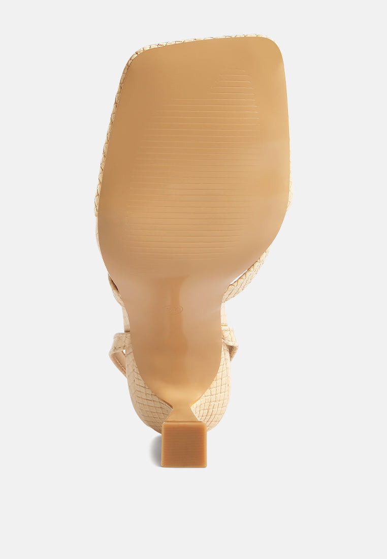 Bottom view of London Rag International ankle strap spool heel sandals with textured design