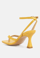 Yellow ankle strap spool heel sandals with textured pattern from London Rag International