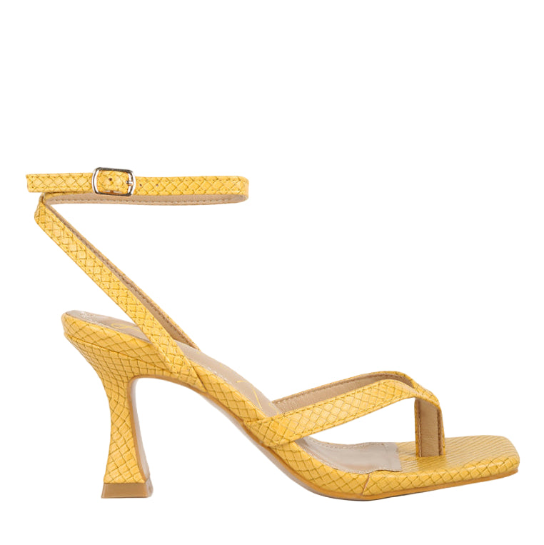 Stylish yellow ankle strap spool heel sandals with textured design for trendy women