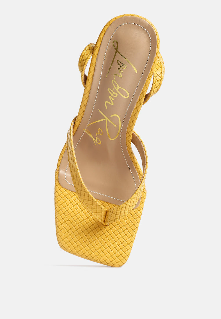 Yellow ankle strap spool heel sandals with a stylish textured design from London Rag International