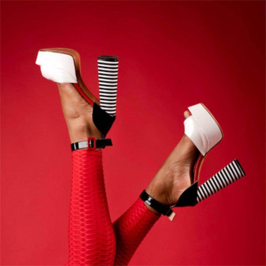 Stylish women's ankle strap square heel shoes in black and white with a bold design