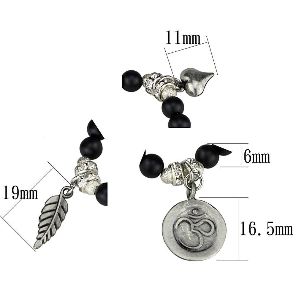 Antique silver brass bracelet for women featuring black beads and detailed charms