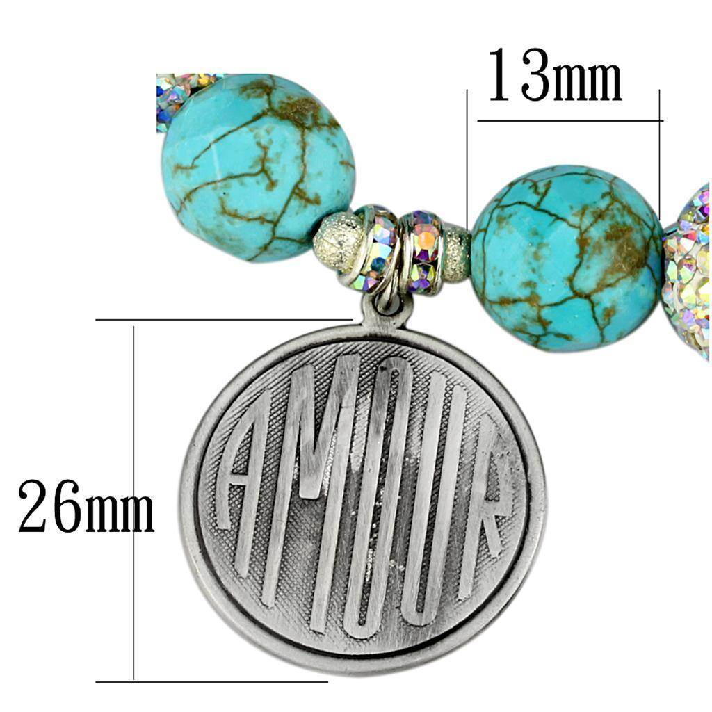 Antique silver women's bracelet featuring turquoise beads with a charm reading AMOUR