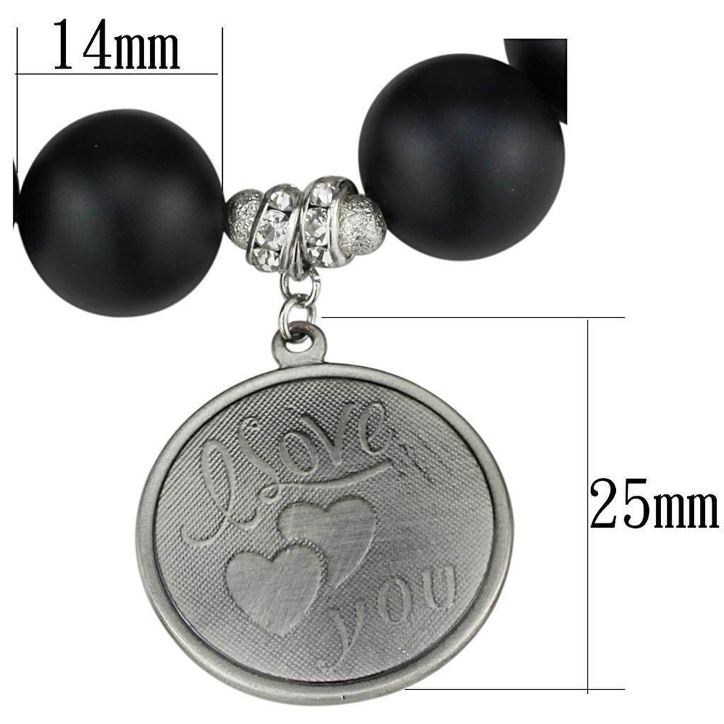 Antique silver women's bracelet with black beads and a charm that reads 'I love you'