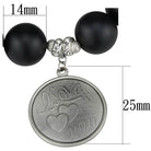 Antique silver women's bracelet with black beads and a charm that reads 'I love you'