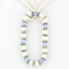 Antique silver women's bracelet featuring blue beads and genuine pearls for a stylish accessory
