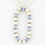 Antique silver women's bracelet featuring blue beads and genuine pearls for a stylish accessory