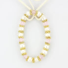 Elegant antique silver women's bracelet adorned with pearls and pink crystals for a stylish look