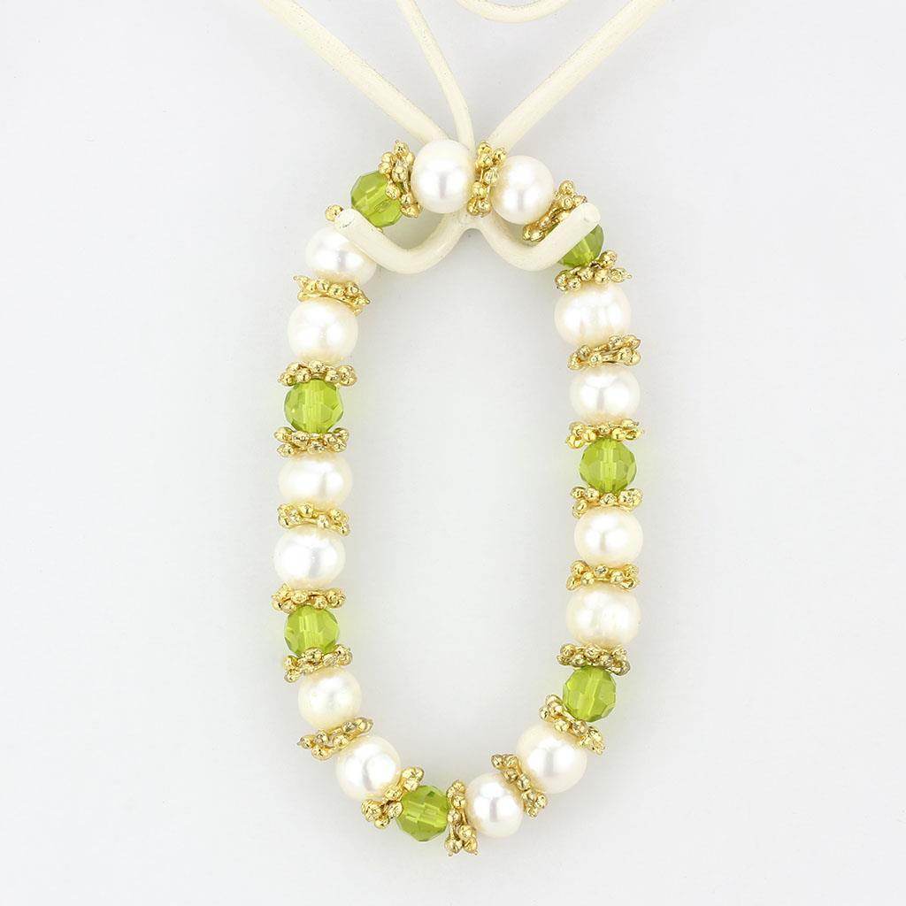 Antique silver women's bracelet adorned with white pearls and green crystals for an elegant touch