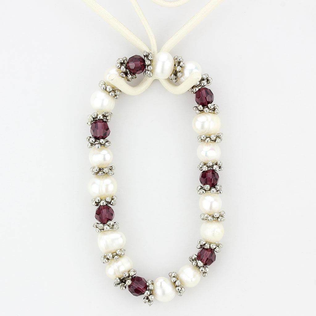 Antique silver women's bracelet adorned with pearls and garnet beads for elegant occasions