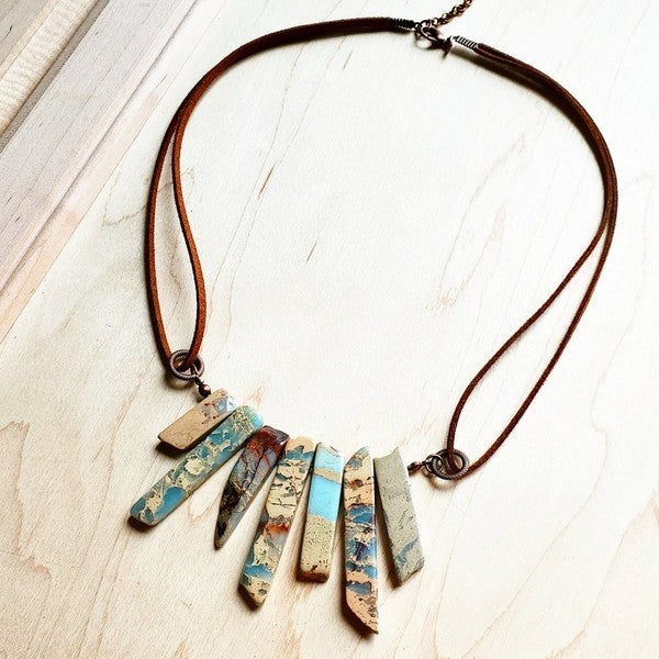 Aqua Terra leather necklace featuring multi-colored pendants on a brown cord for a unique accessory