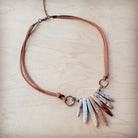 Aqua Terra leather necklace featuring colorful stone spikes on a brown leather cord