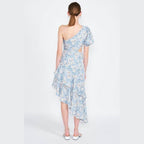 Back view of Emory Park asymmetric one shoulder dress in blue floral pattern, featuring ruffled hem