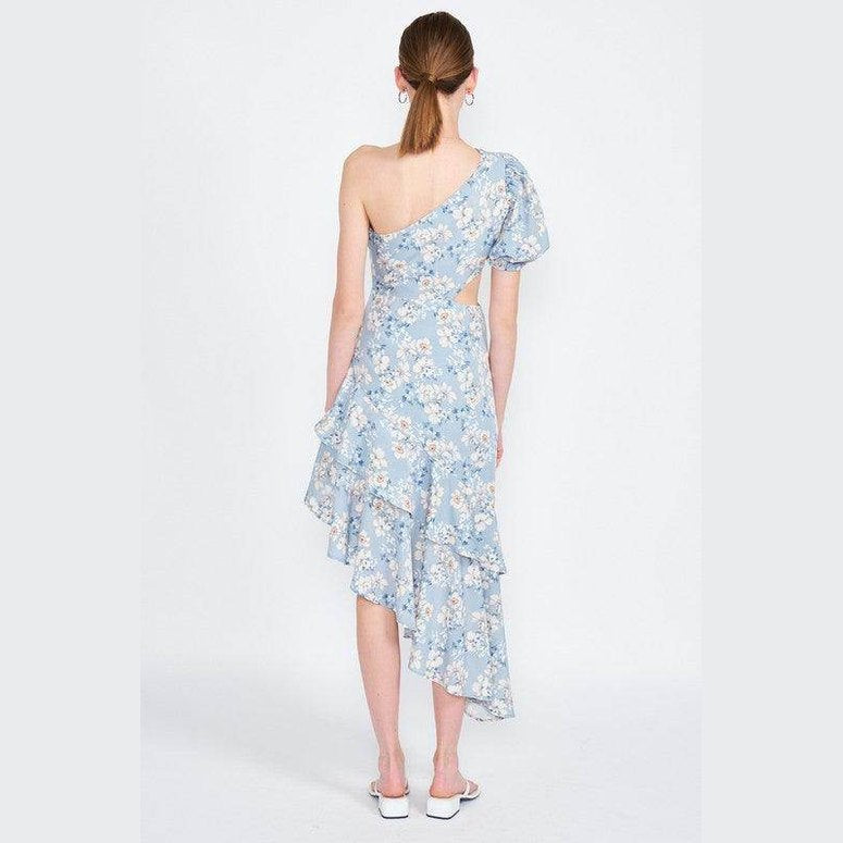 Back view of Emory Park asymmetric one shoulder dress in blue floral pattern, featuring ruffled hem