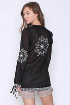 Qwasabee Aztec long sleeve top in black with intricate embroidered designs on the back