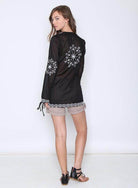 Qwasabee Aztec long sleeve top in black with intricate embroidery on sleeves and hem