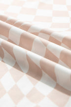 Close-up of a long sleeve checkerboard shirt women in soft pink and white fabric