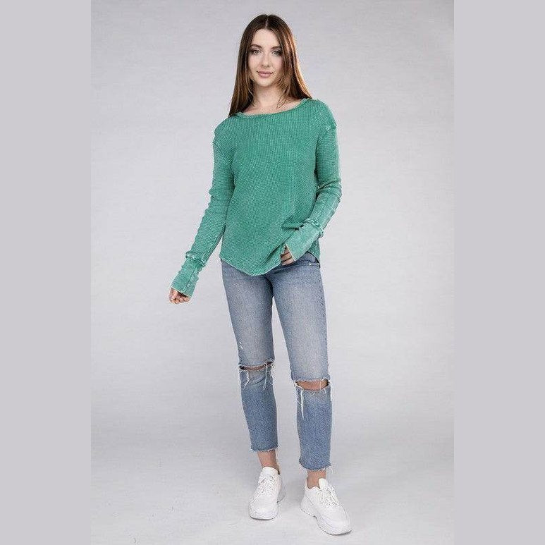 Female model wearing a ZENANA baby waffle knit shirt in green paired with distressed jeans