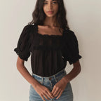 Women's black babydoll top in lightweight cotton, stylish casual wear