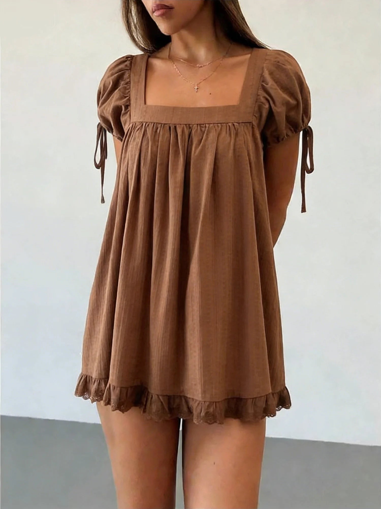 Women's brown babydoll top in lightweight fabric, perfect for casual outings
