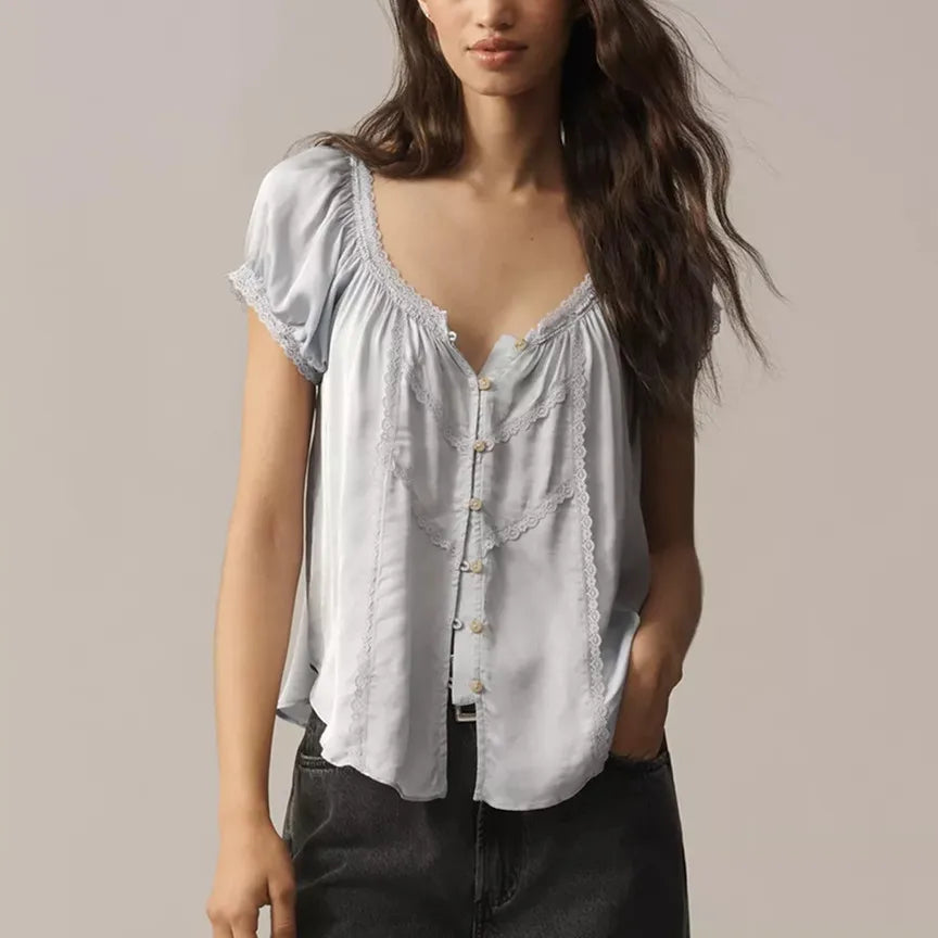 Light blue babydoll top with button closure, perfect for casual wear