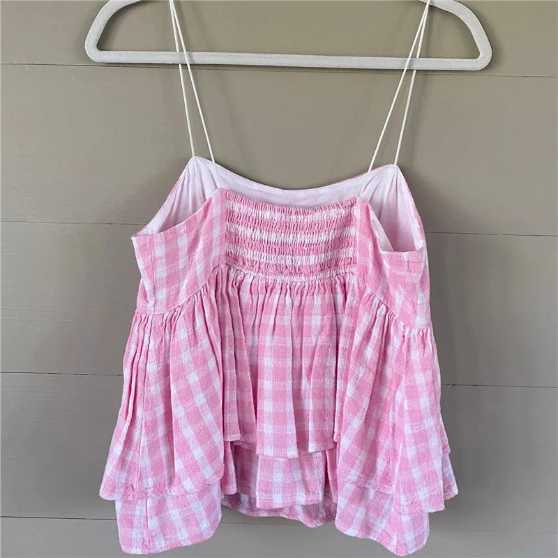 Pink gingham babydoll top with adjustable straps for summer outings