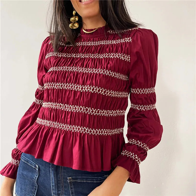Women's burgundy babydoll top with intricate smocking details
