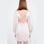 Back view of Emory Park back strap tulip mini dress with elegant tie detail and puff sleeves