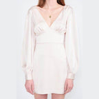 Emory Park back strap tulip mini dress in soft blush with elegant long sleeves and a flattering V-neck