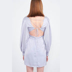 Back view of Emory Park back strap tulip mini dress in light gray with open back design and puff sleeves