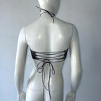 Black backless bandage clubwear tank with lace-up tie detail on mannequin back