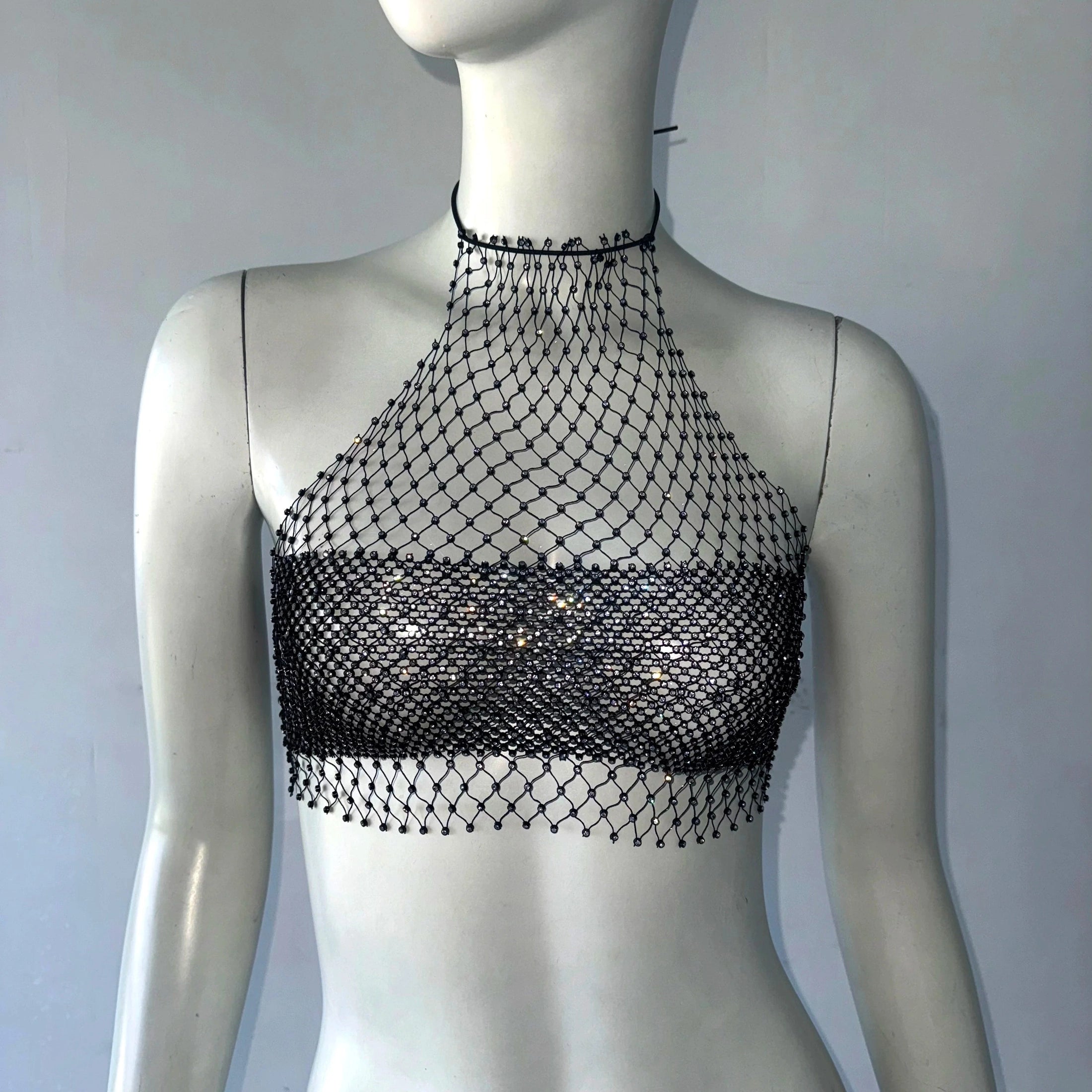 Black backless bandage clubwear tank with mesh net overlay on white mannequin by VacationGrabs