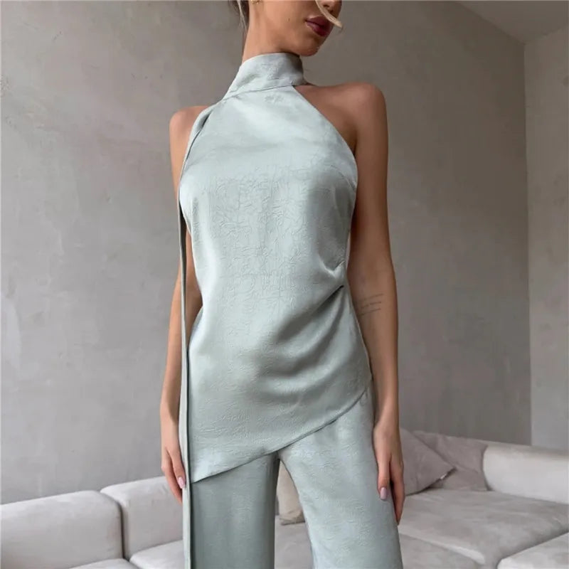 Women's backless top in light green satin for stylish occasions