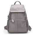 Gray leather backpack for travelling for women with multiple pockets