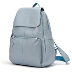 Light blue leather backpack for travelling for women with multiple pockets