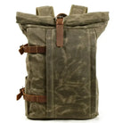 Brown canvas roll-top backpack with quality leather protection for outdoor adventures