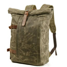 Men's olive green canvas backpack with quality leather protection, perfect for outdoor adventures