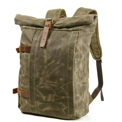 Men's olive green canvas backpack with quality leather protection, perfect for outdoor adventures