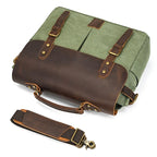 Green canvas messenger bag with brown leather accents and detachable strap