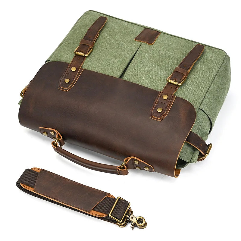 Green canvas messenger bag with brown leather accents and detachable strap