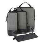 Set of three gray compression packing cubes for travel organization