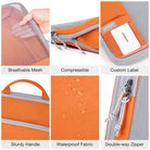 Orange compression packing cubes for travel made of waterproof fabric